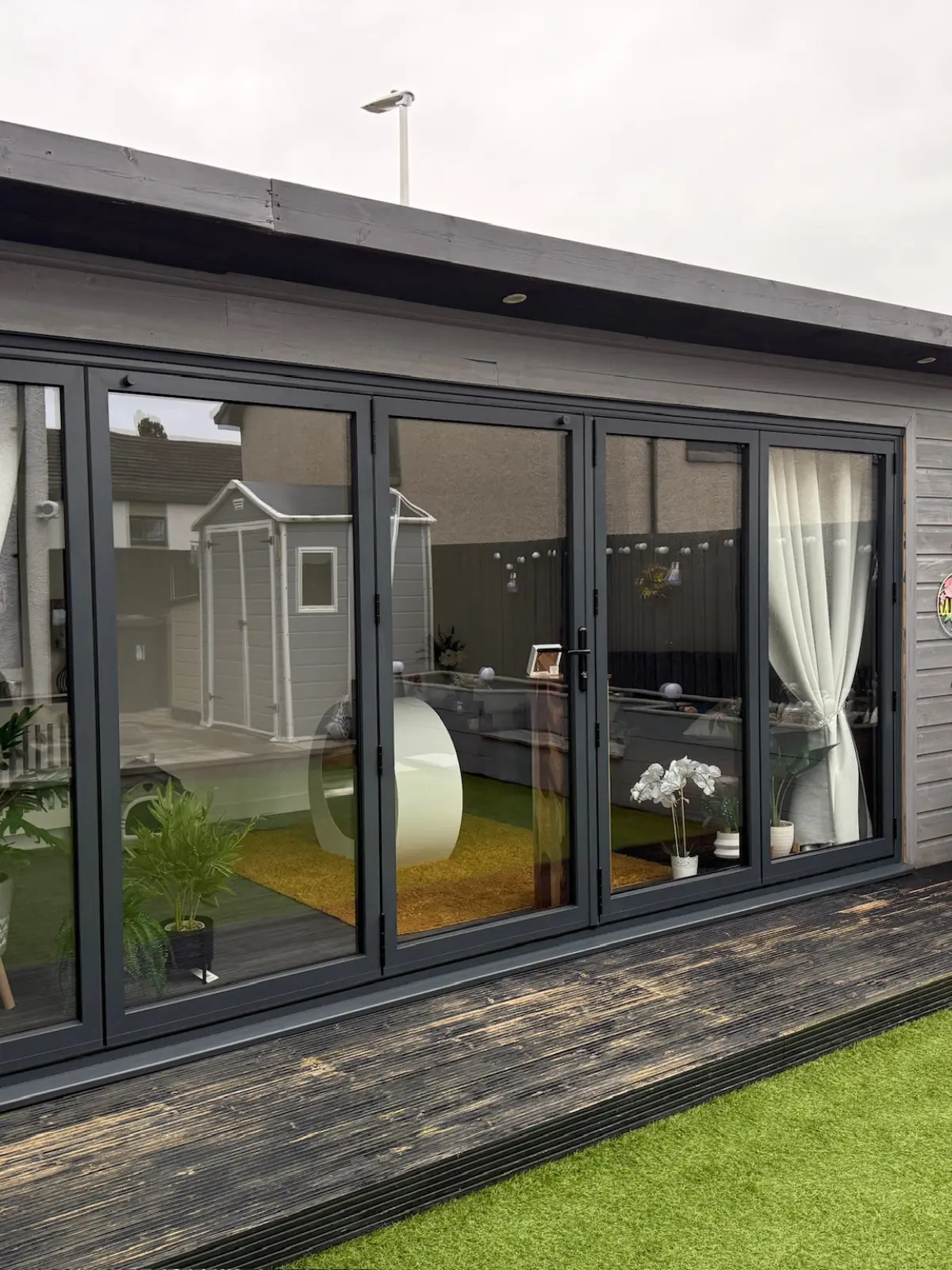 Bi-folding doors installed by Meraki Halo onto rear decking