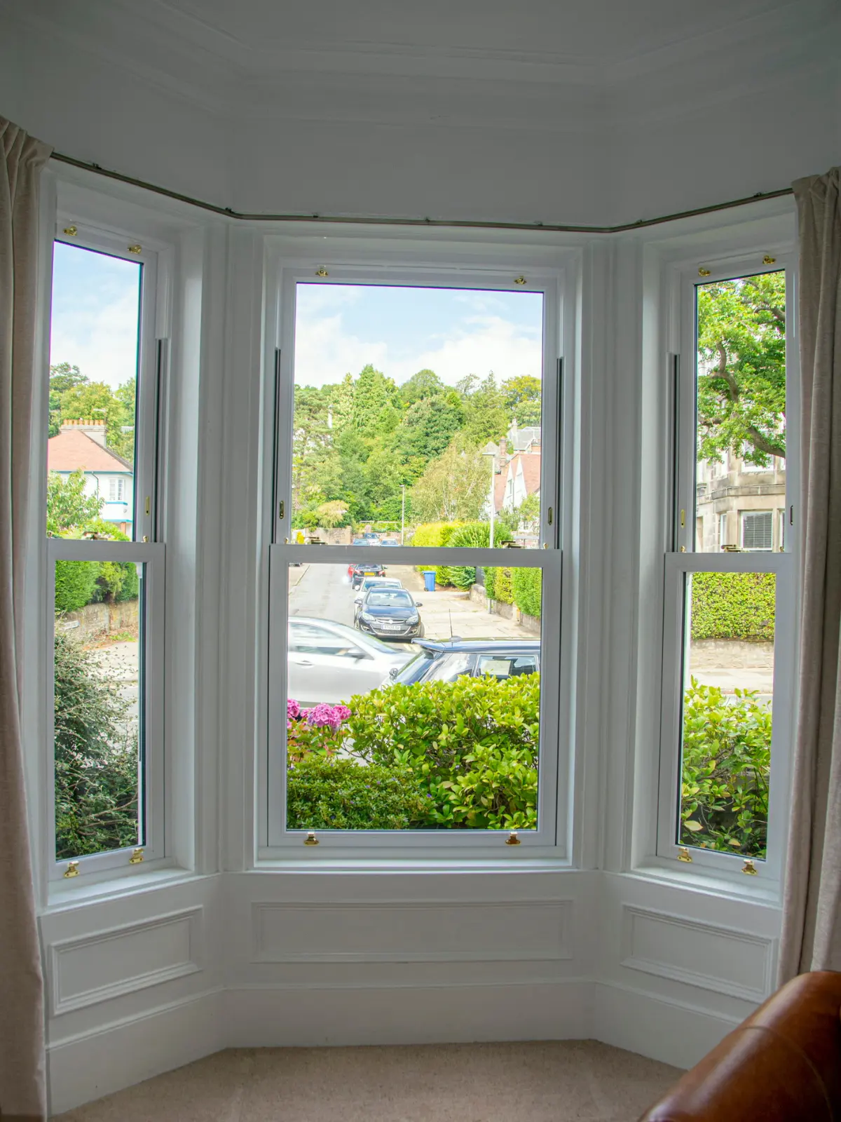 White uPVC sliding sash bay window installation, Dundee