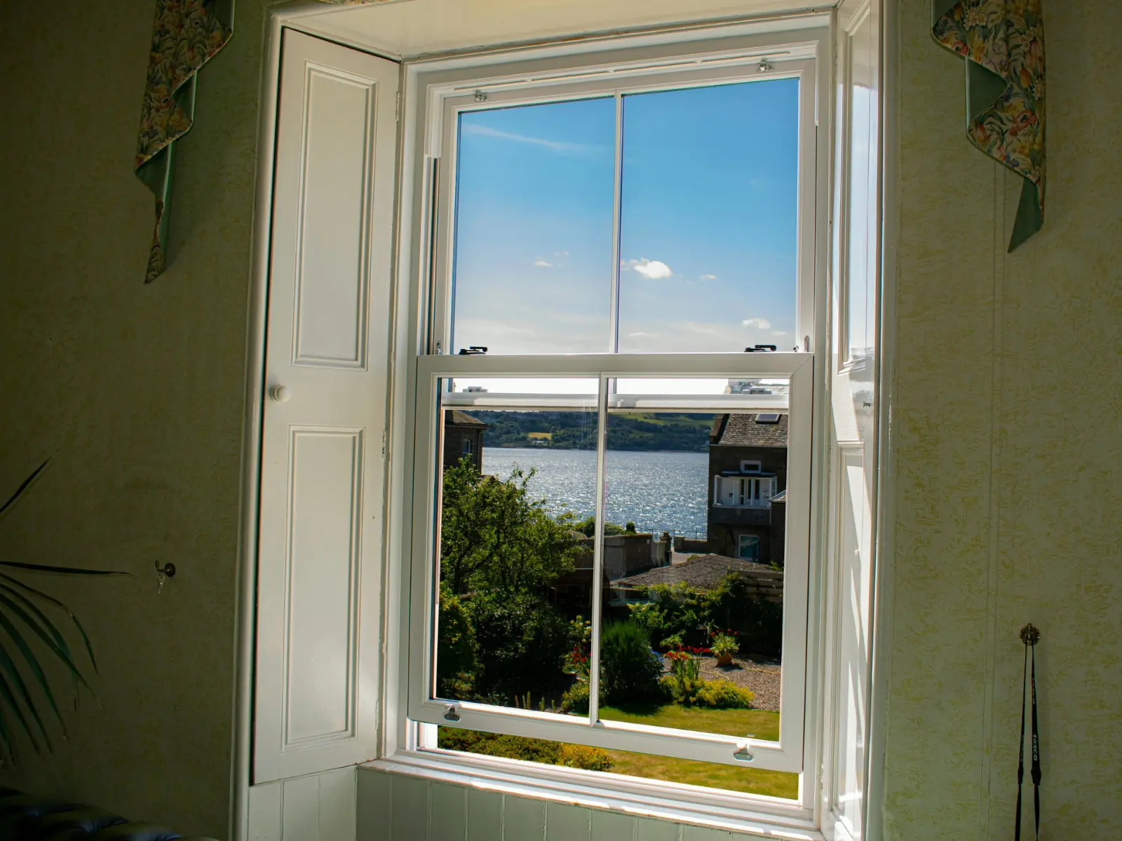 White uPVC sliding sash window installation, Dundee