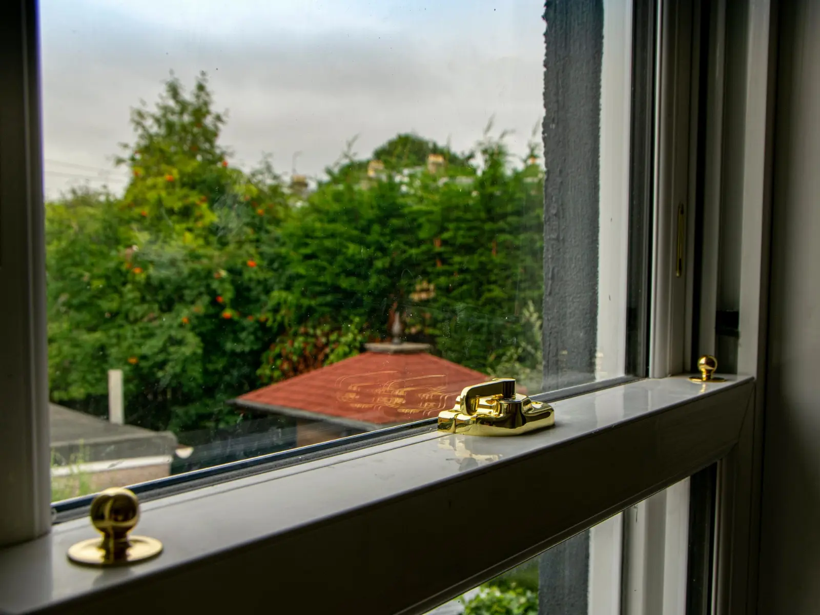 White uPVC sliding sash window installation, Dundee