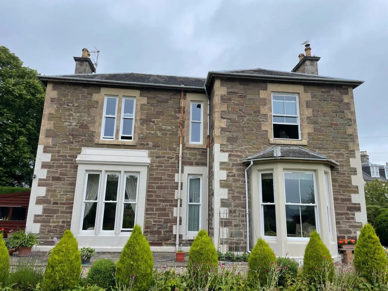 White uPVC sliding sash window installation, Dundee